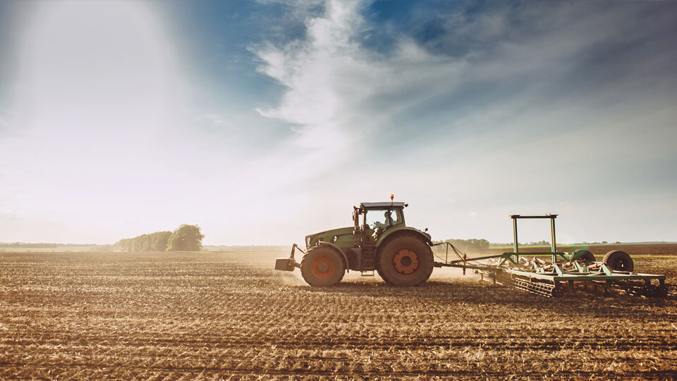 food supply chain sustainable tractor crops image